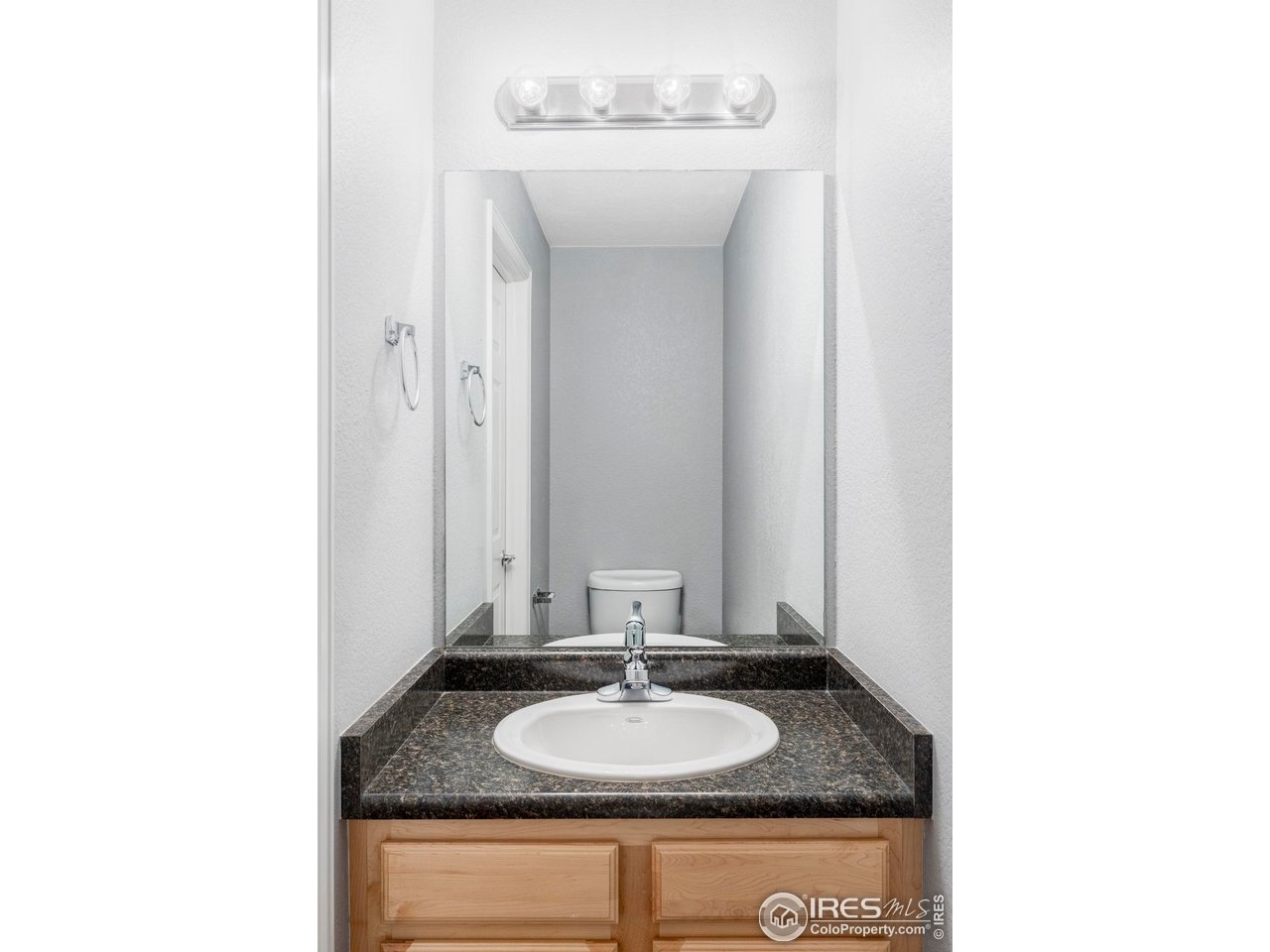 4240 Riley Drive Longmont, CO 80503 - Photo 17 of 25 A powder room completes the main level.