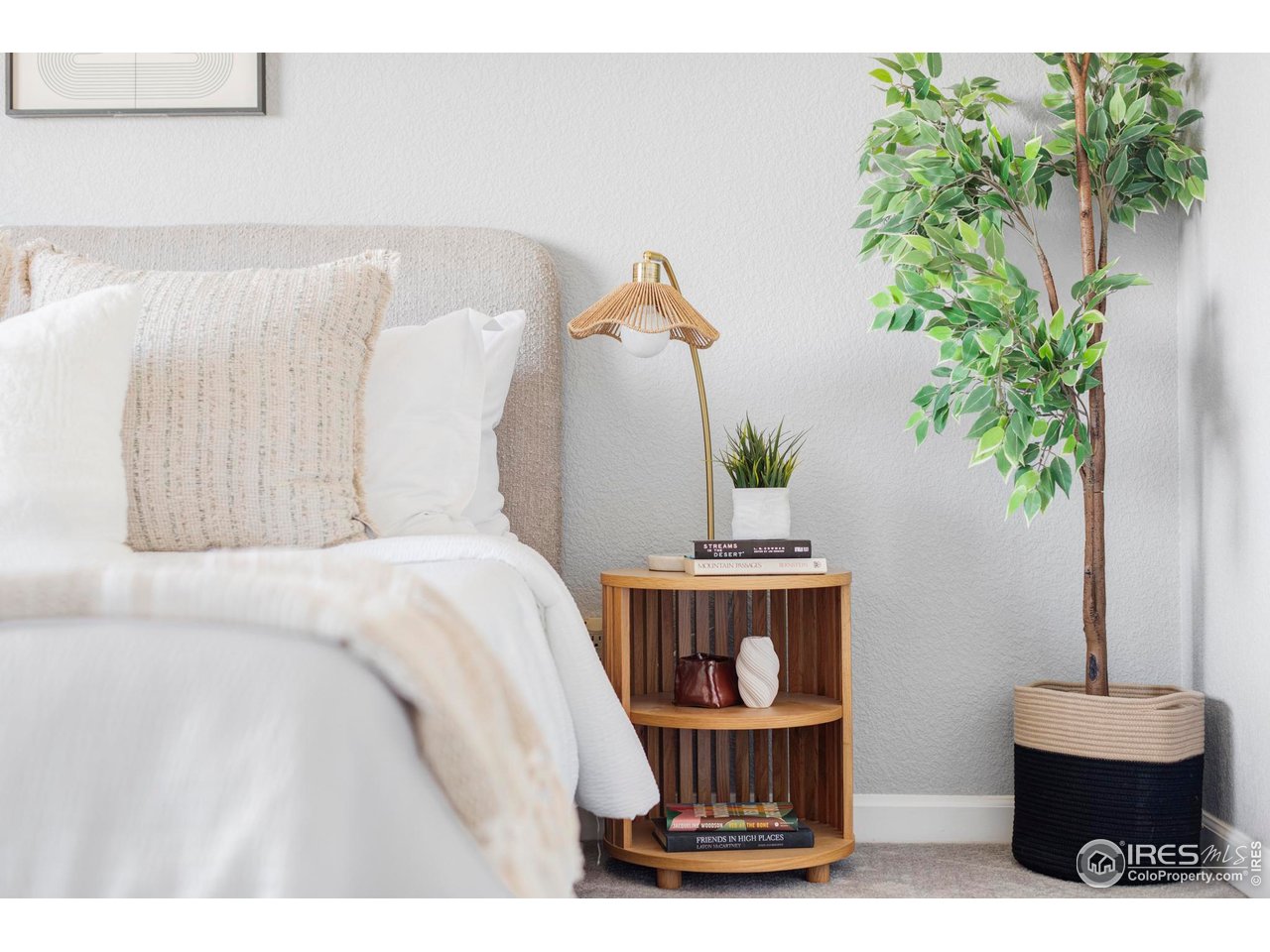 4240 Riley Drive Longmont, CO 80503 - Photo 19 of 25 The second bedroom with an en-suite bathroom provides ideal flexibility for guests or a home office, while the upper-level laundry adds everyday convenience.