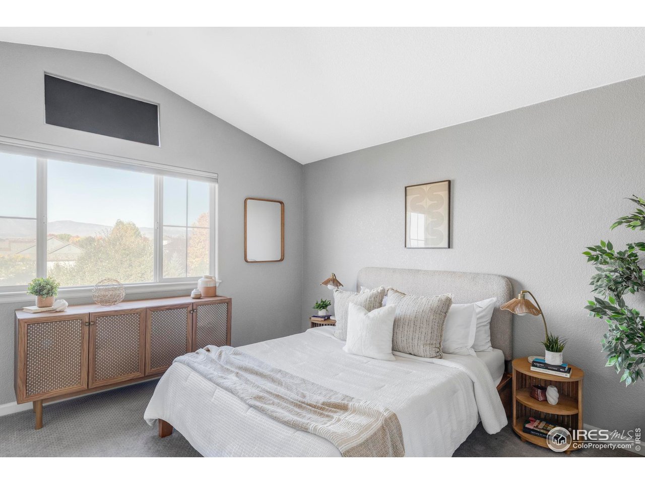 4240 Riley Drive Longmont, CO 80503 - Photo 4 of 25 Upstairs, the primary suite offers picturesque mountain views, dual closets, and a private en-suite bath.