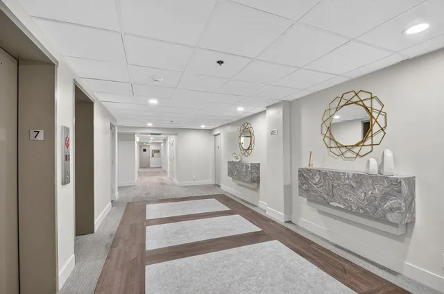 a view of a swimming pool and an outdoor seating