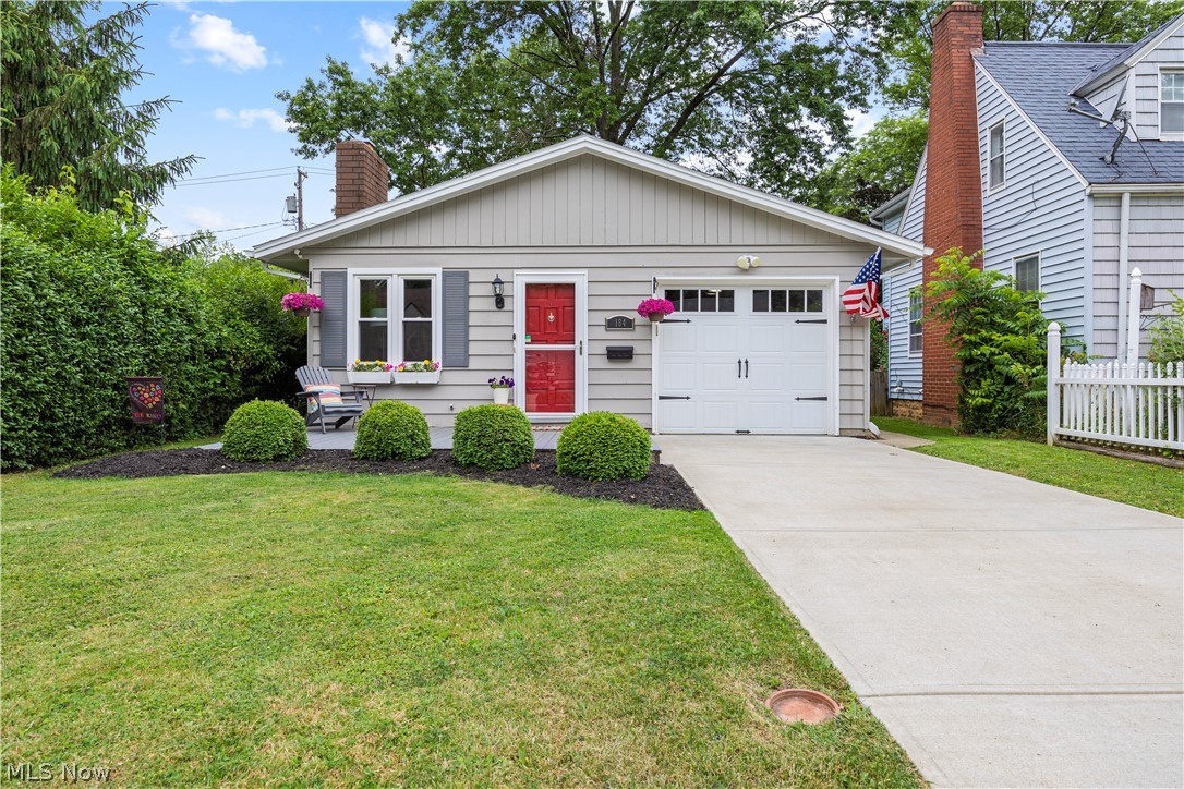 184 Sunset Road Avon Lake, OH 44012 - Photo 2 of 35 View of front facade with a garage and a front yard