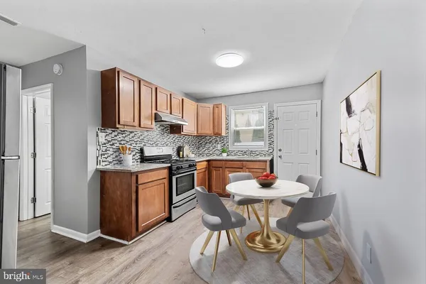 a bedroom with a bed and a potted plant