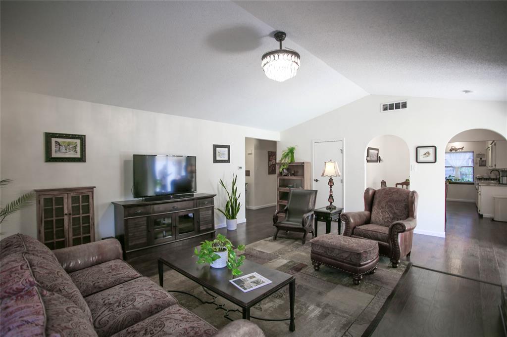 1720 Crystal Way Plano, TX 75074 - Photo 7 of 32 a living room with furniture and a flat screen tv