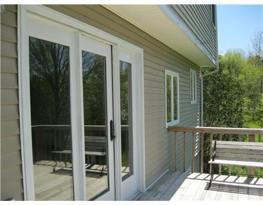 24 Harriman Road Orland, ME 04472 - Photo 11 of 12 Exterior Front. Deck doors lead to...