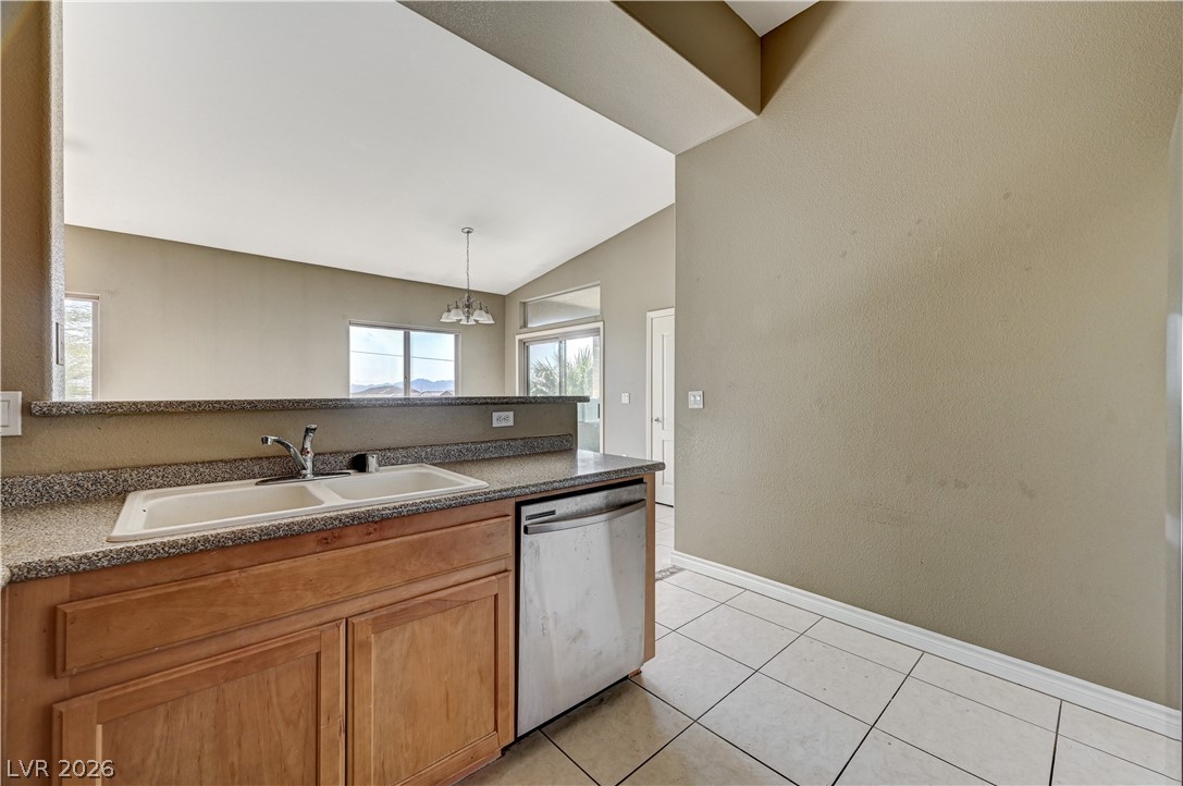 8985 South Durango Drive, Unit 2187 Las Vegas, NV 89113 - Photo 12 of 73 A well-equipped kitchen provides essential amenities, with a clear view into the adjacent living space.