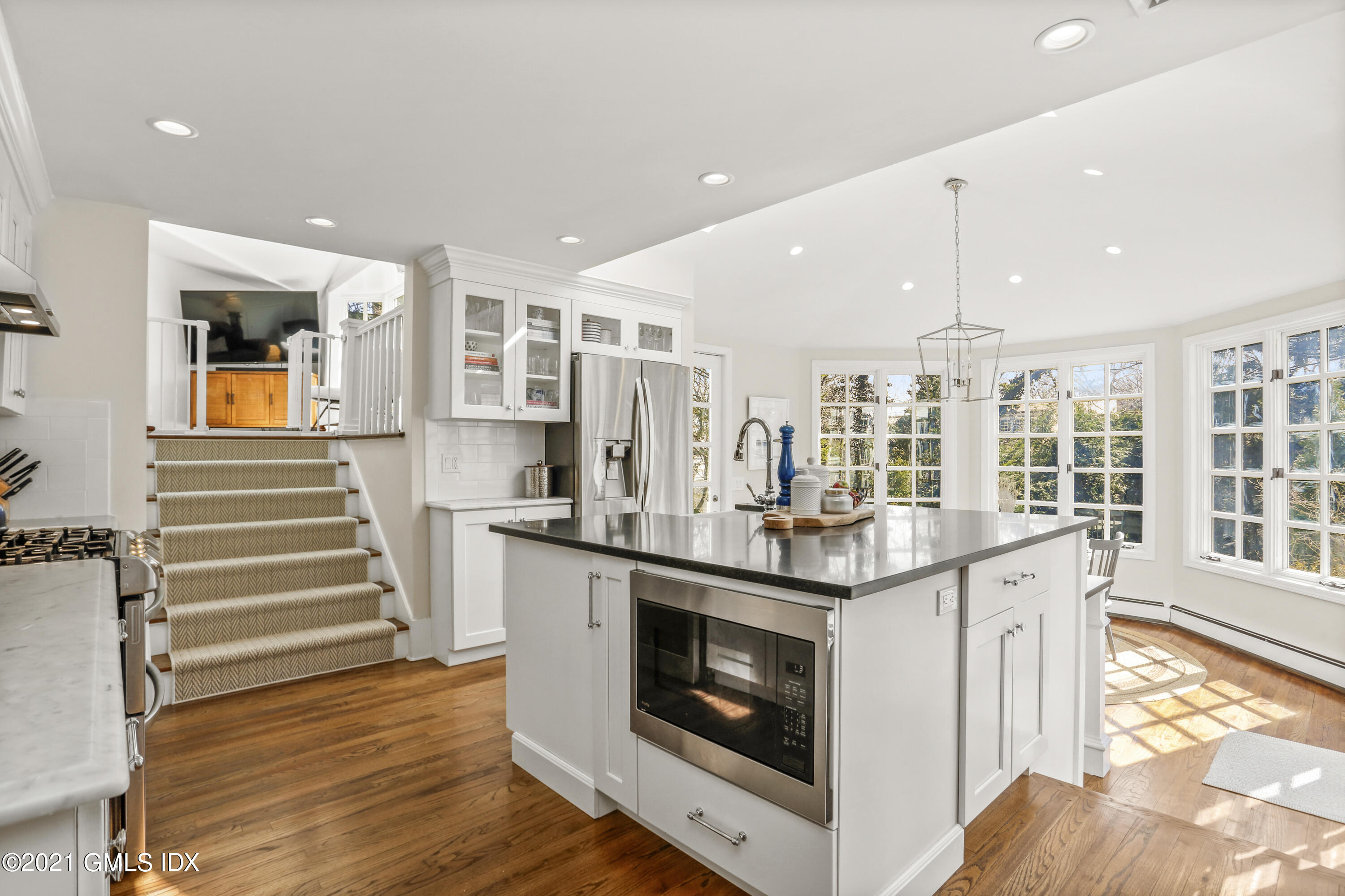52 Winthrop Drive Riverside, CT 06878 - Photo 12 of 34 a kitchen with stainless steel appliances granite countertop a stove and a wooden floors