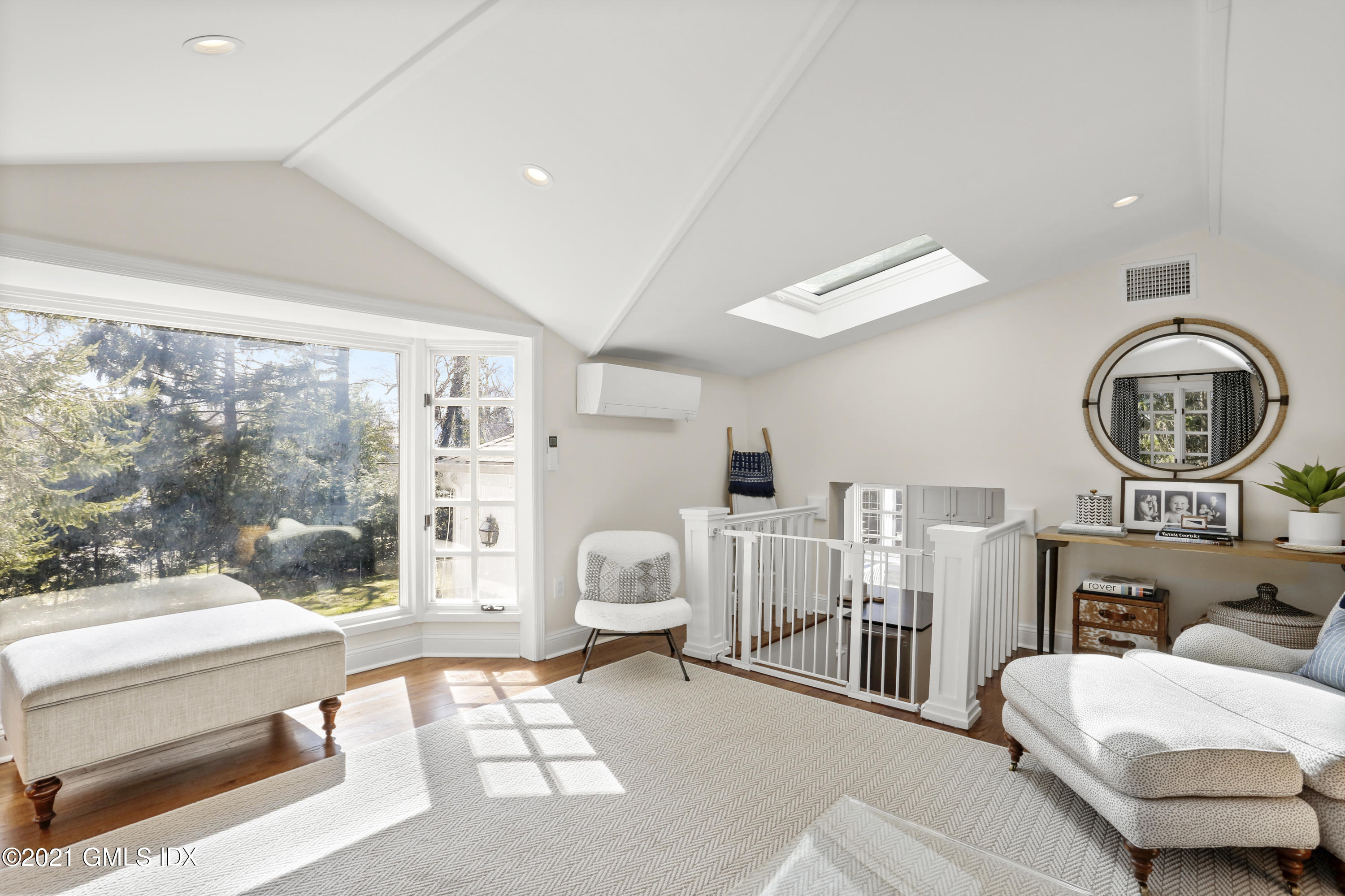 52 Winthrop Drive Riverside, CT 06878 - Photo 17 of 34 a living room with furniture a rug and a large window