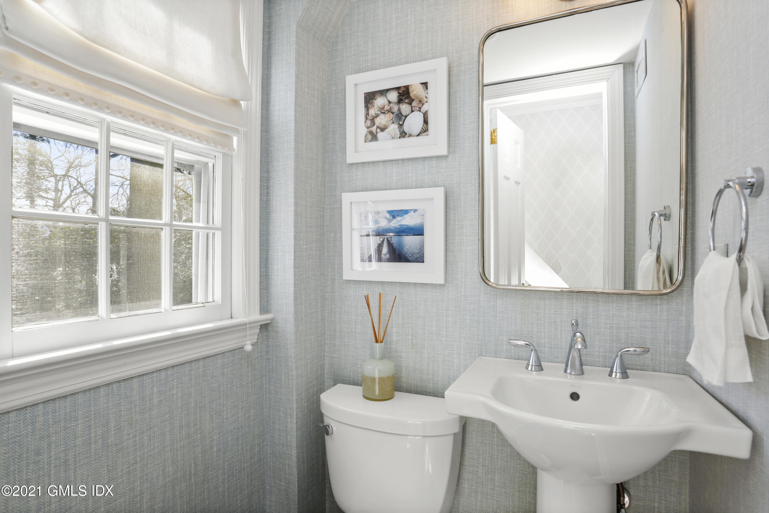 52 Winthrop Drive Riverside, CT 06878 - Photo 18 of 34 a bathroom with a toilet a sink and mirror