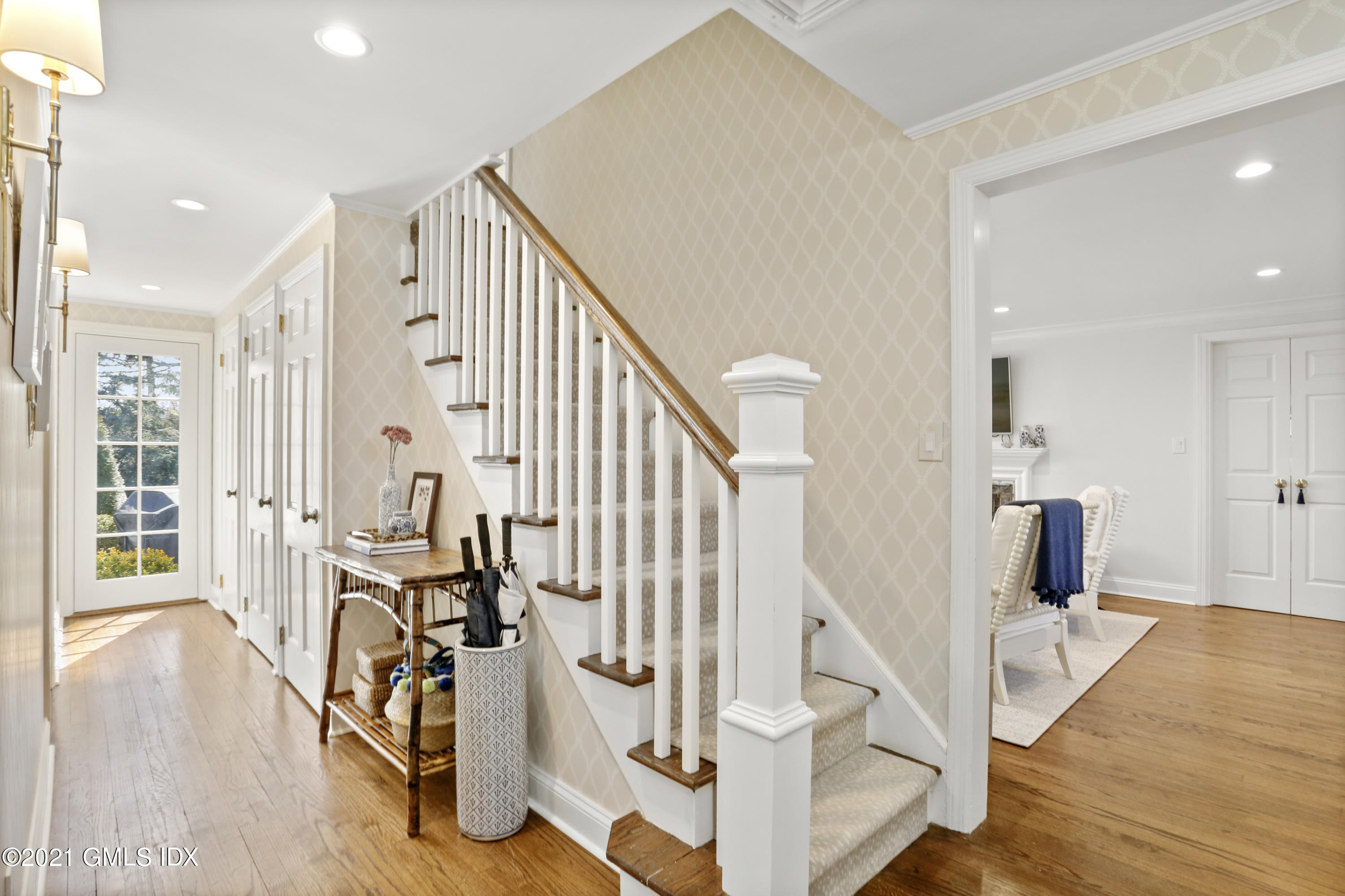 52 Winthrop Drive Riverside, CT 06878 - Photo 19 of 34 a view of a hallway with wooden floor and staircase