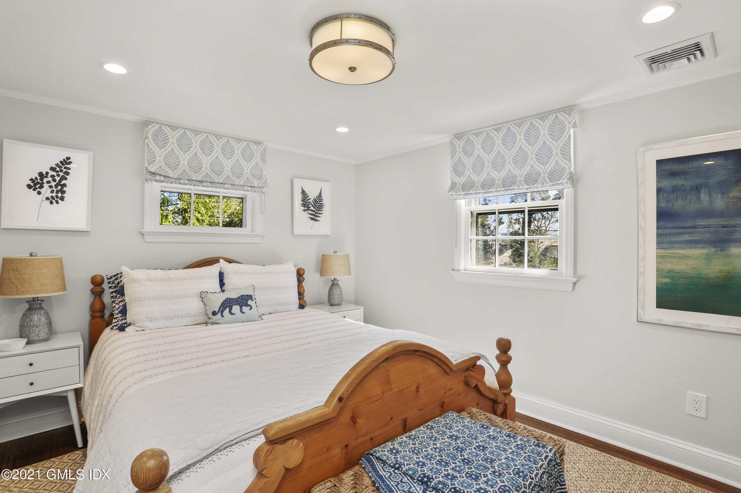 52 Winthrop Drive Riverside, CT 06878 - Photo 21 of 34 a bedroom with a bed and a chandelier