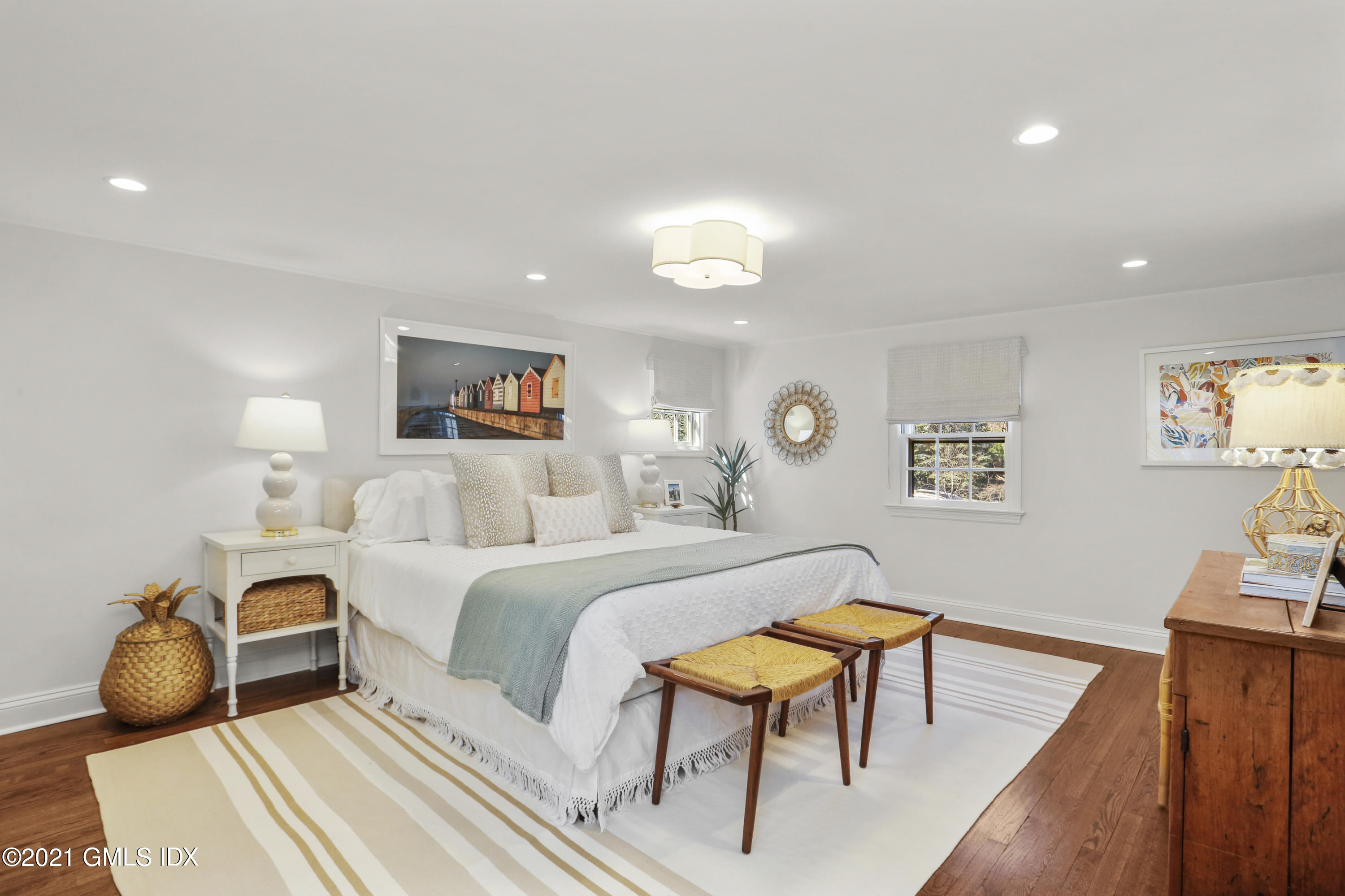 52 Winthrop Drive Riverside, CT 06878 - Photo 23 of 34 a bedroom with a bed and wooden floor