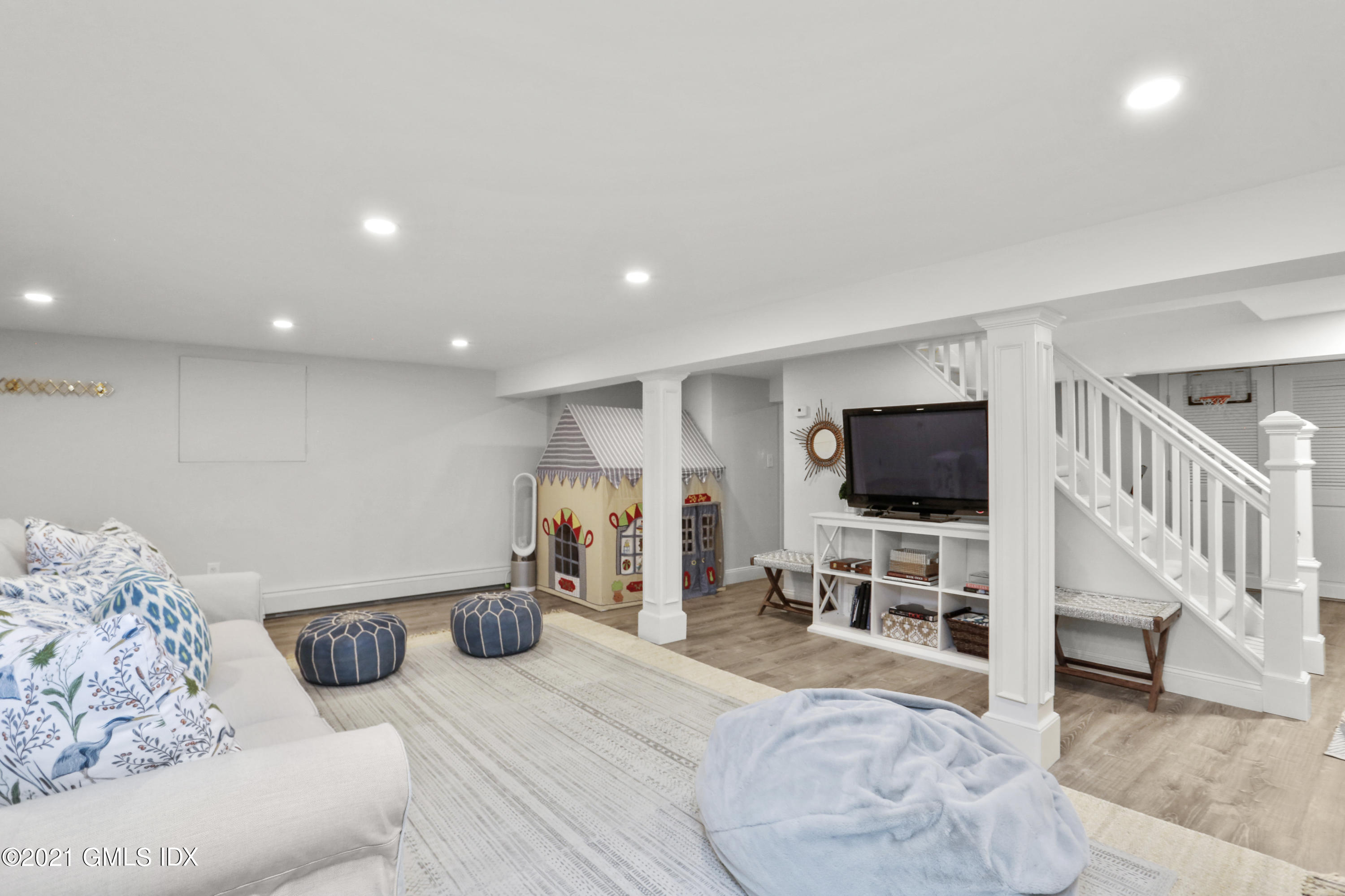 52 Winthrop Drive Riverside, CT 06878 - Photo 27 of 34 a bedroom with furniture and a flat screen tv