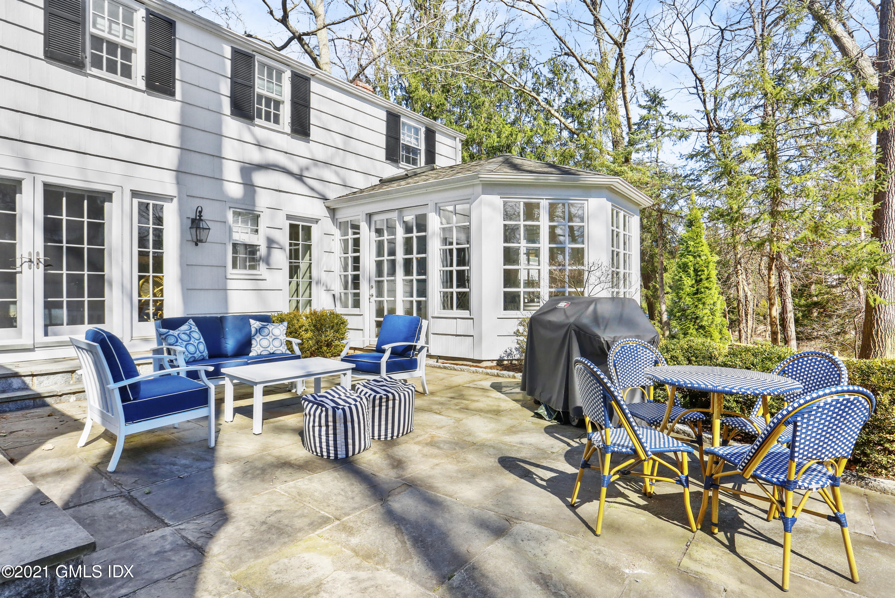 52 Winthrop Drive Riverside, CT 06878 - Photo 29 of 34 a view of a patio with couches table and chairs and wooden fence