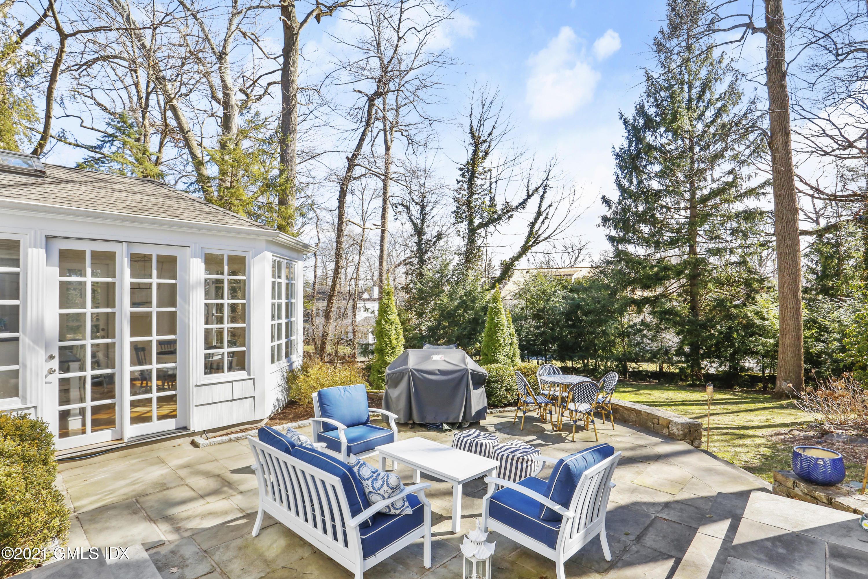 52 Winthrop Drive Riverside, CT 06878 - Photo 30 of 34 a view of a patio with couches table and chairs and wooden fence
