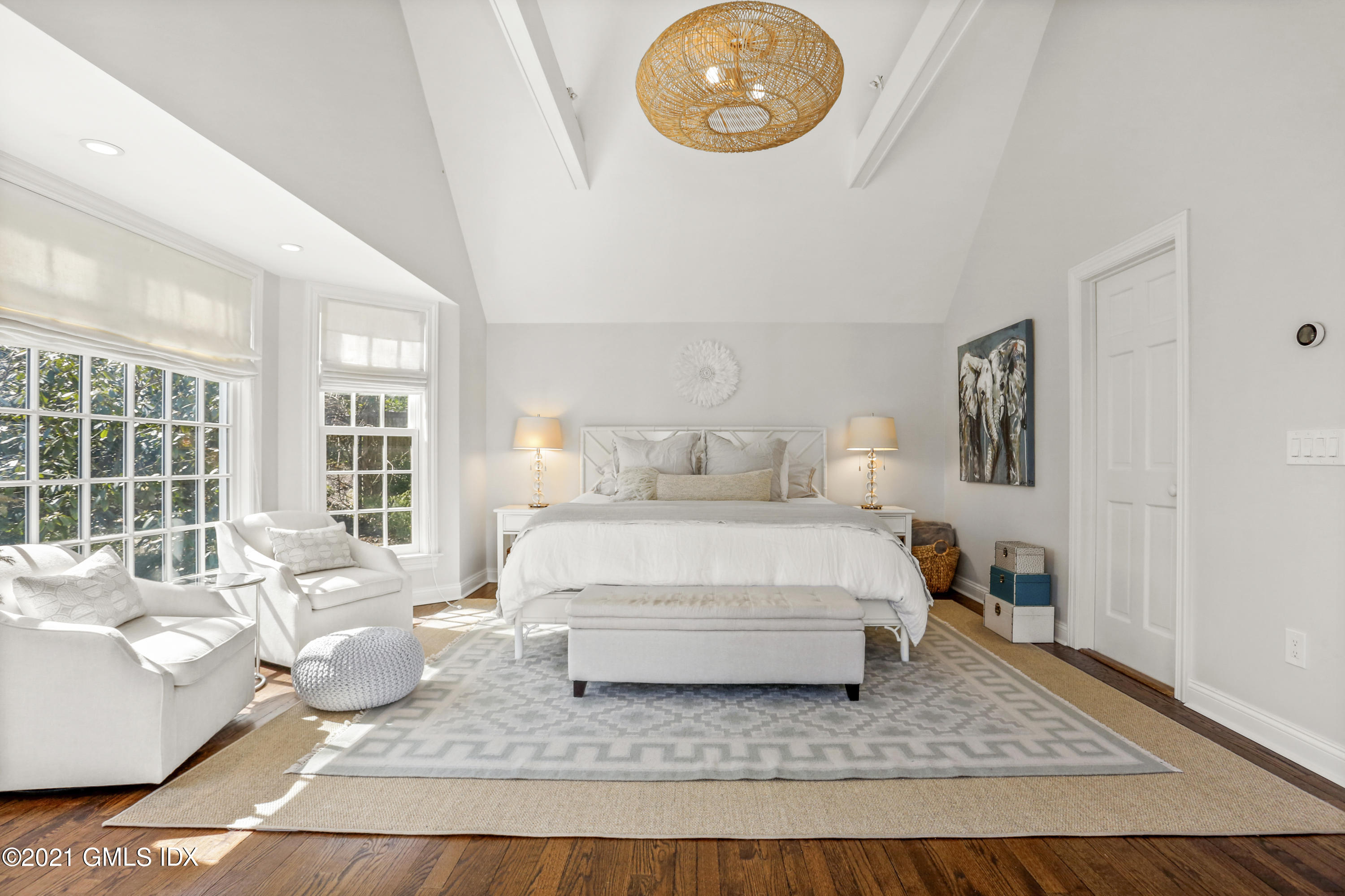 52 Winthrop Drive Riverside, CT 06878 - Photo 7 of 34 a spacious bedroom with a bed a couch and a large window