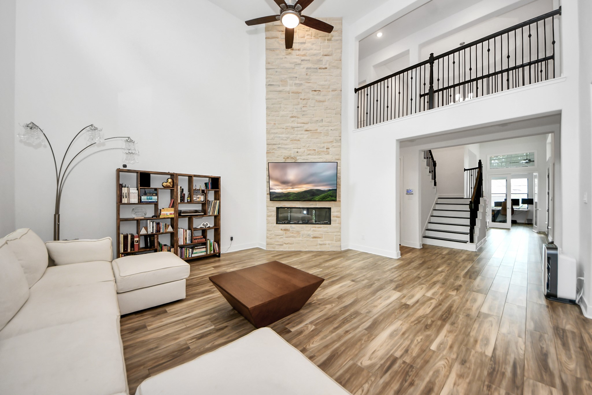 17355 Camillia Trail Conroe, TX 77302 - Photo 10 of 34 a living room with furniture and a book shelf