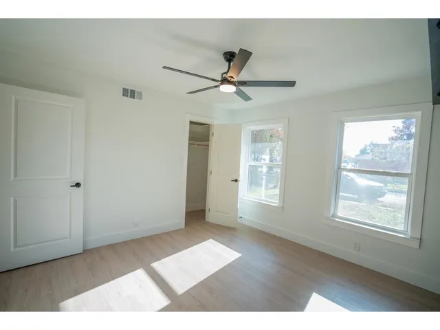 a view interior of a house a ceiling fan and windows