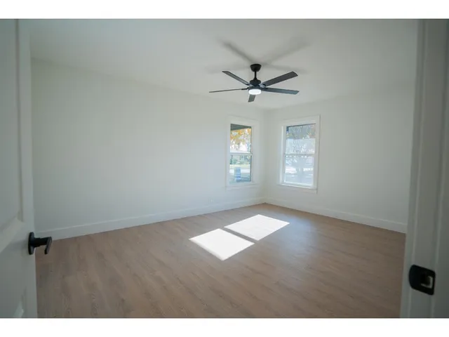 a view of empty room with windows