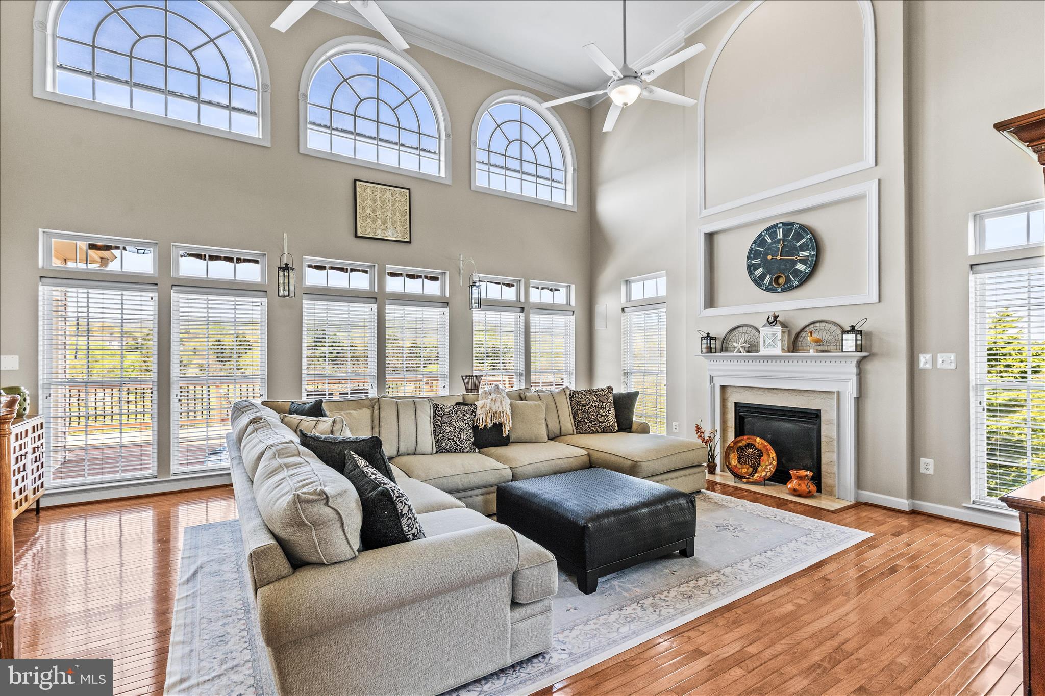 40 Fawn Hill Road Hanover, PA 17331 - Photo 13 of 99 a living room with furniture a fireplace and floor to ceiling windows