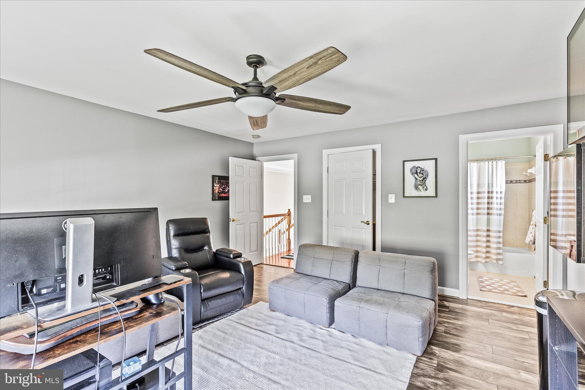 40 Fawn Hill Road Hanover, PA 17331 - Photo 58 of 99 a living room with furniture a ceiling fan and a flat screen tv