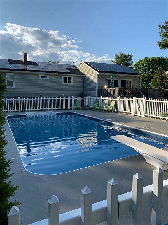 223 Charge Pond Road Wareham, MA 02571 - Photo 4 of 10 a view of a house with a swimming pool and sitting area