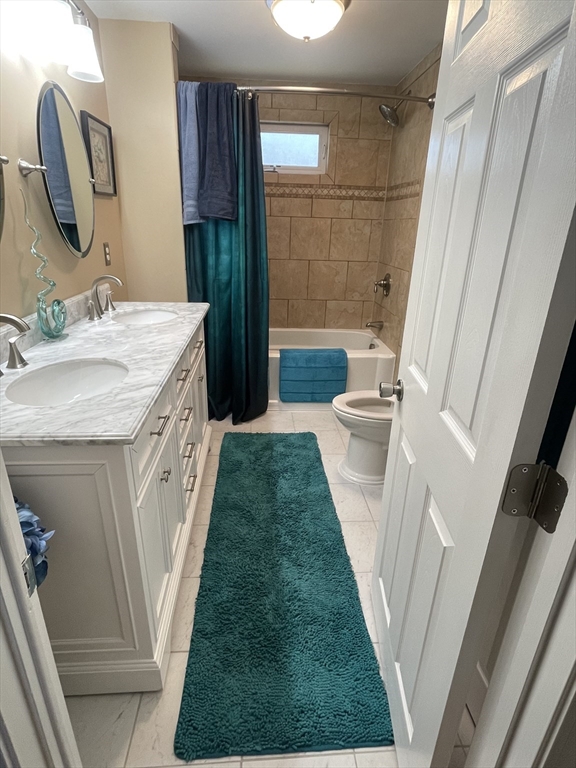 223 Charge Pond Road Wareham, MA 02571 - Photo 7 of 10 a bathroom with a sink a toilet a mirror and shower