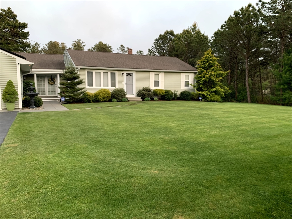 223 Charge Pond Road Wareham, MA 02571 - Photo 8 of 10 a front view of a house with a yard