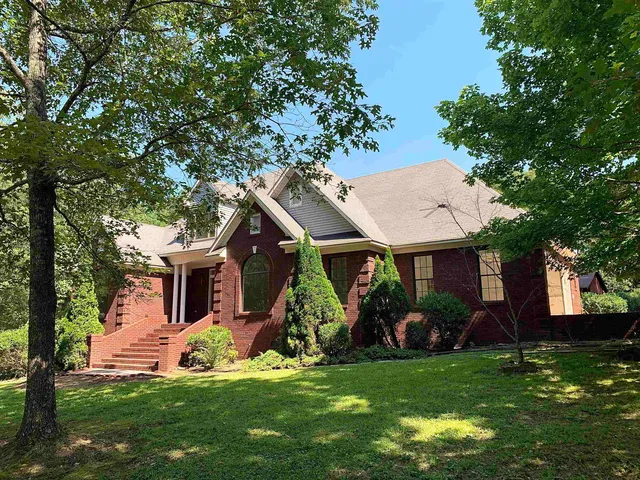 a view of a house with a yard porch and sitting area