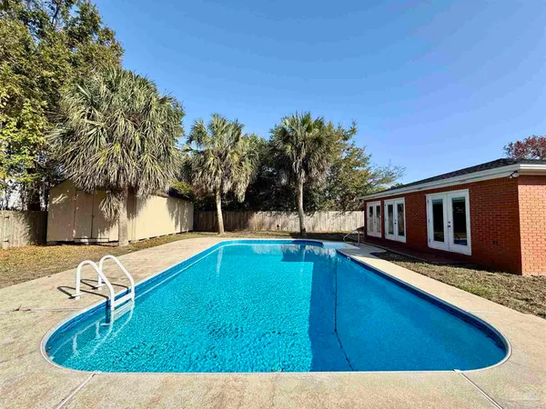 a view of swimming pool with a yard