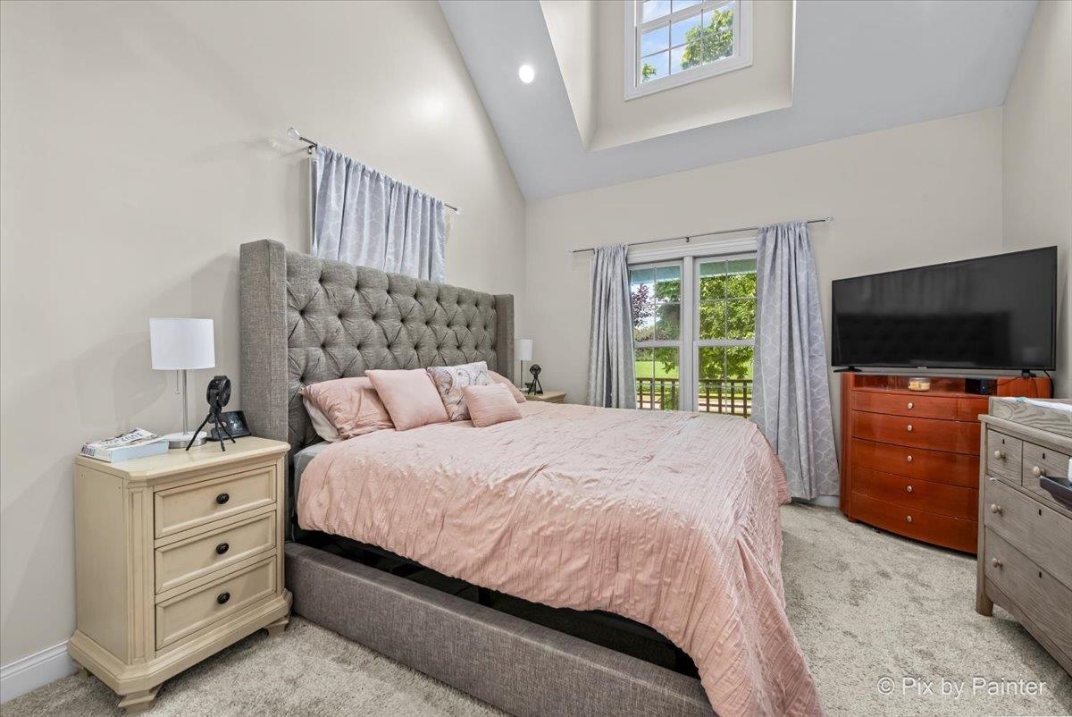 10053 Spring Road Garden Prairie, IL 61038 - Photo 11 of 17 a bedroom with a bed and a flat screen tv