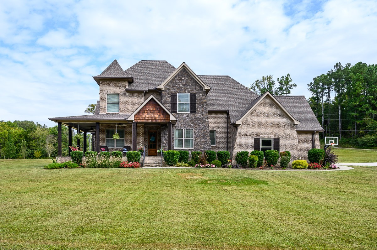 8254 Patterson Road College Grove, TN 37046 - Photo 1 of 30 a front view of a house with garden