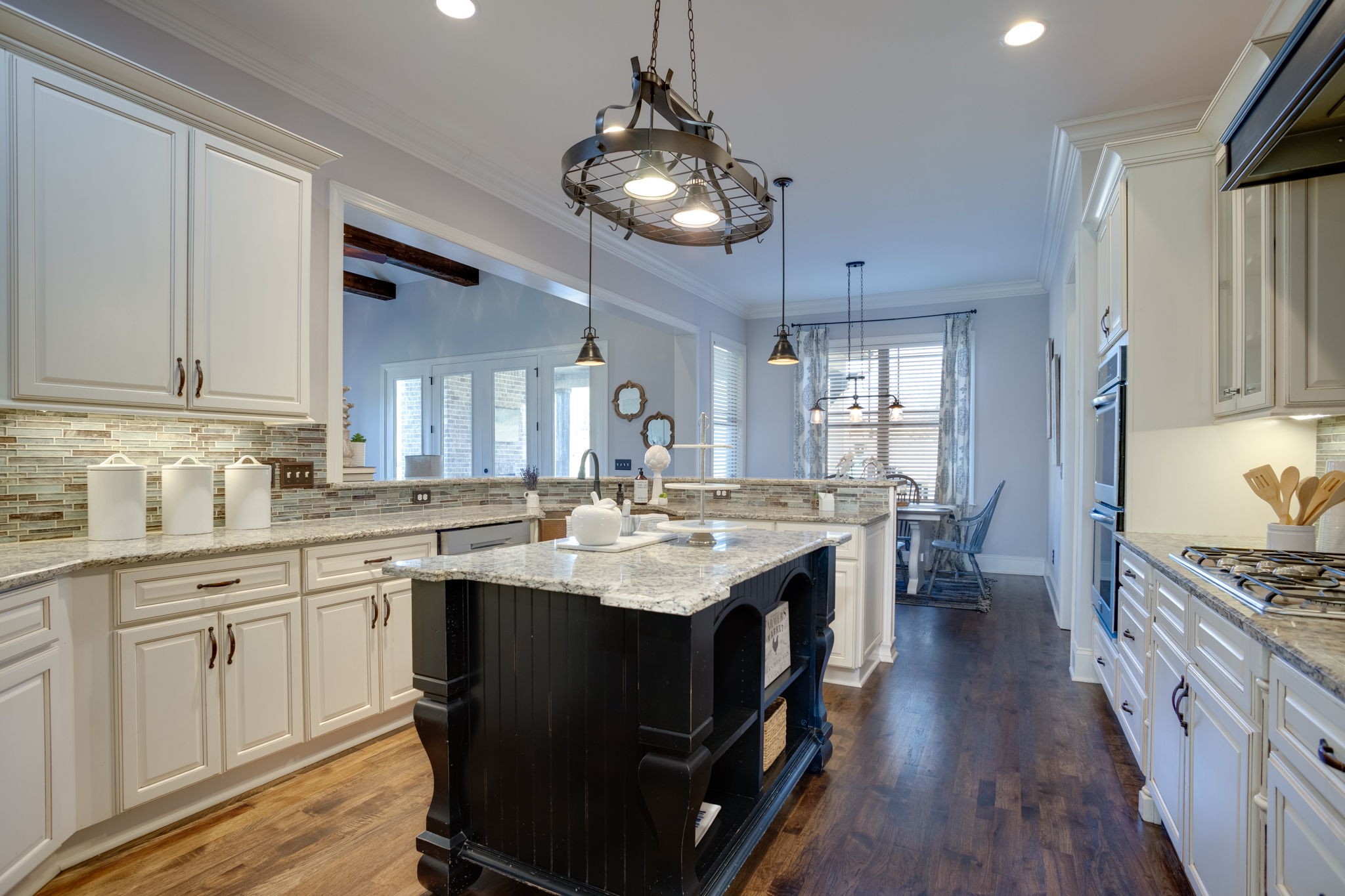 8254 Patterson Road College Grove, TN 37046 - Photo 13 of 30 a kitchen with a sink stove and wooden cabinets