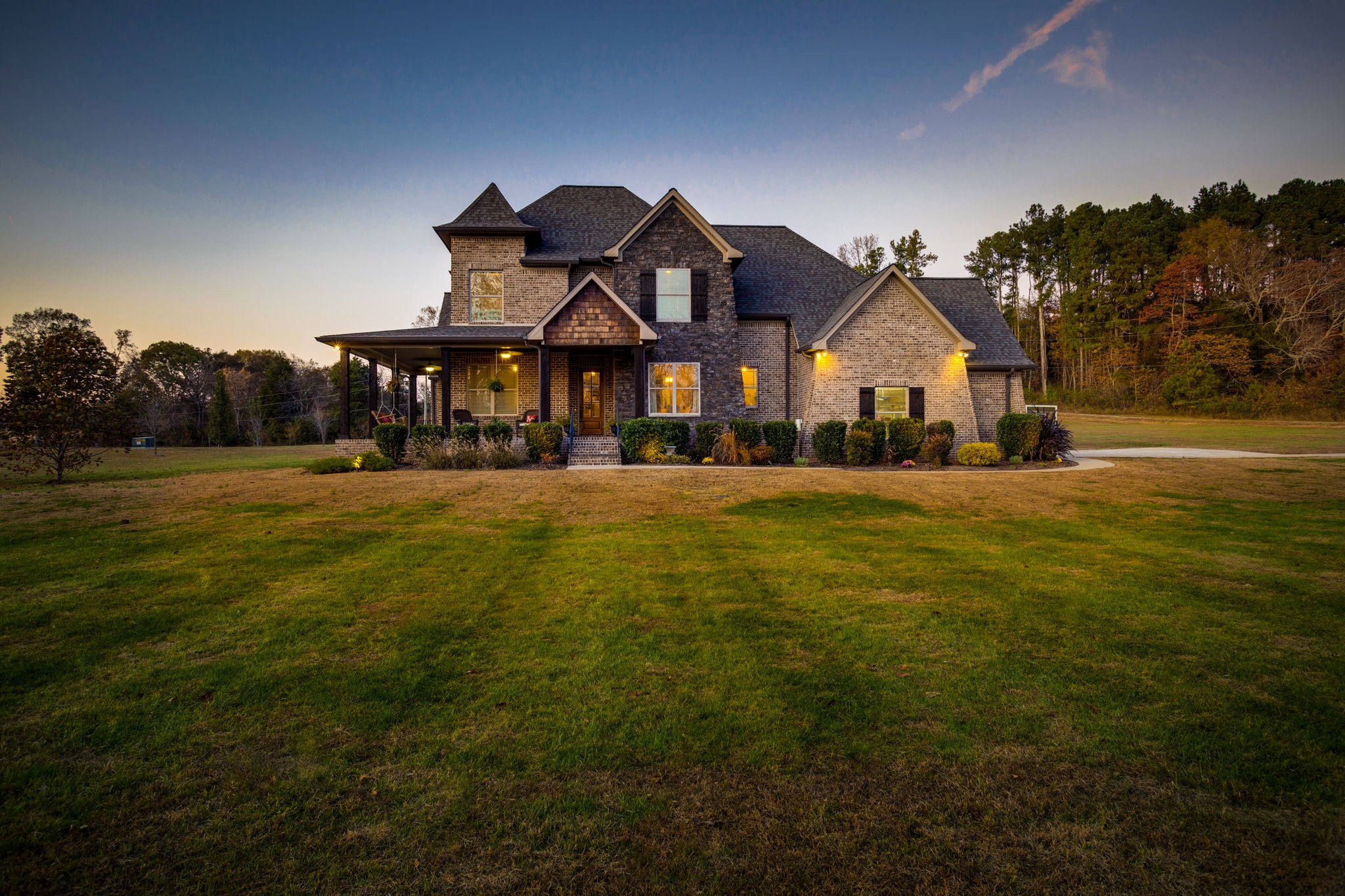 8254 Patterson Road College Grove, TN 37046 - Photo 3 of 30 a front view of house with yard and trees in the background
