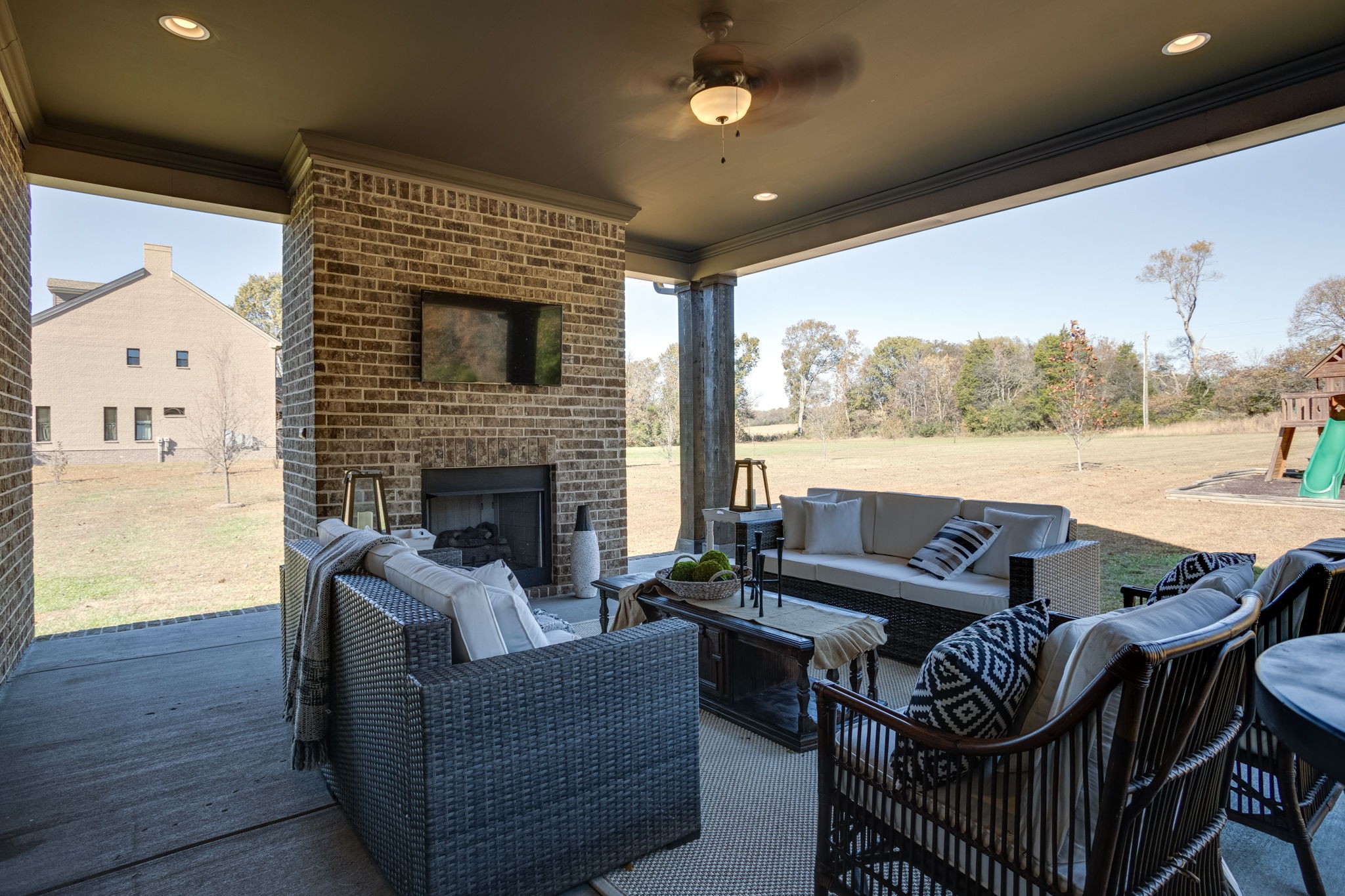 8254 Patterson Road College Grove, TN 37046 - Photo 22 of 30 a outdoor living space with furniture and a fireplace