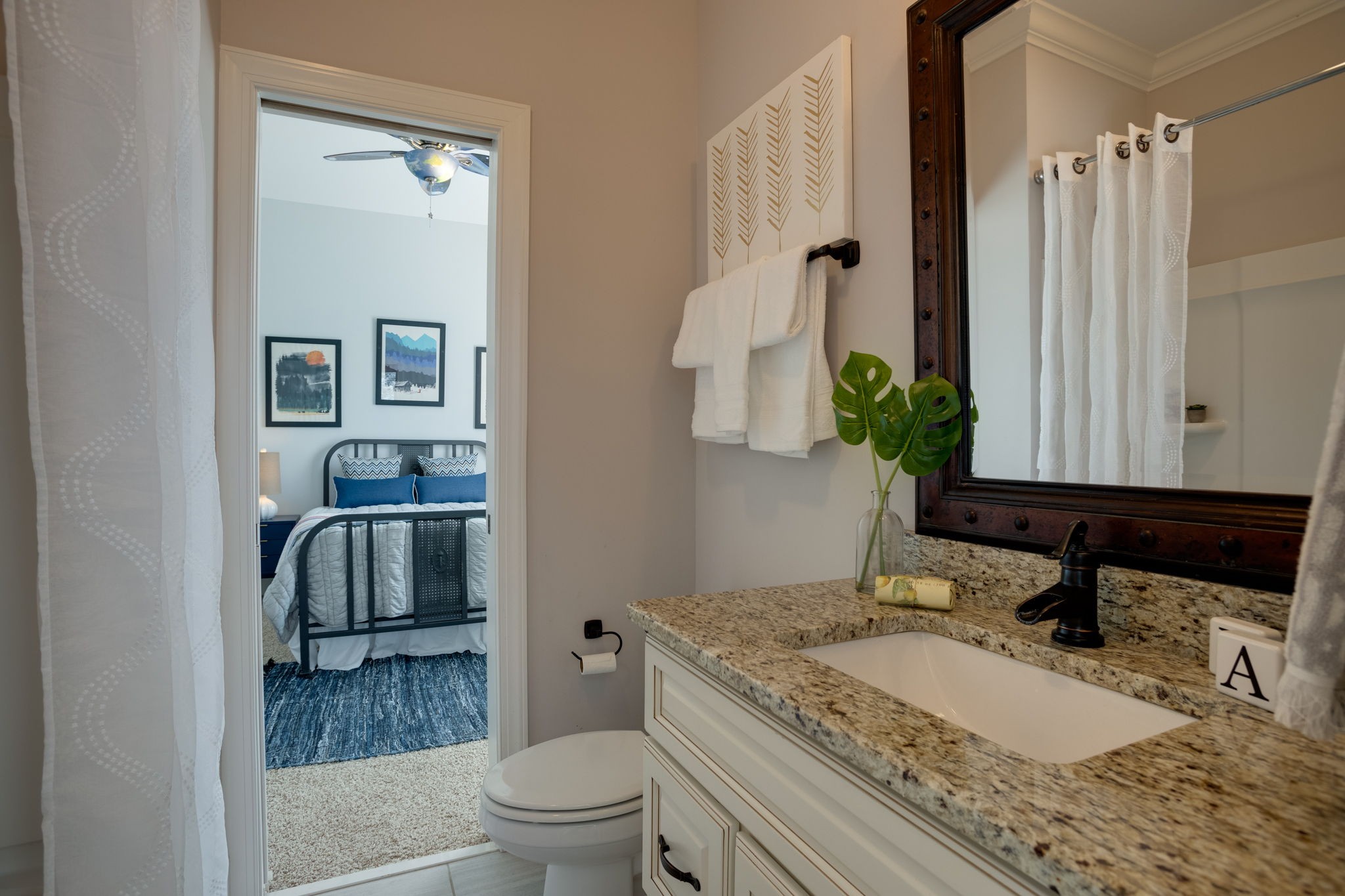 8254 Patterson Road College Grove, TN 37046 - Photo 25 of 30 a bathroom with a granite countertop sink and a mirror