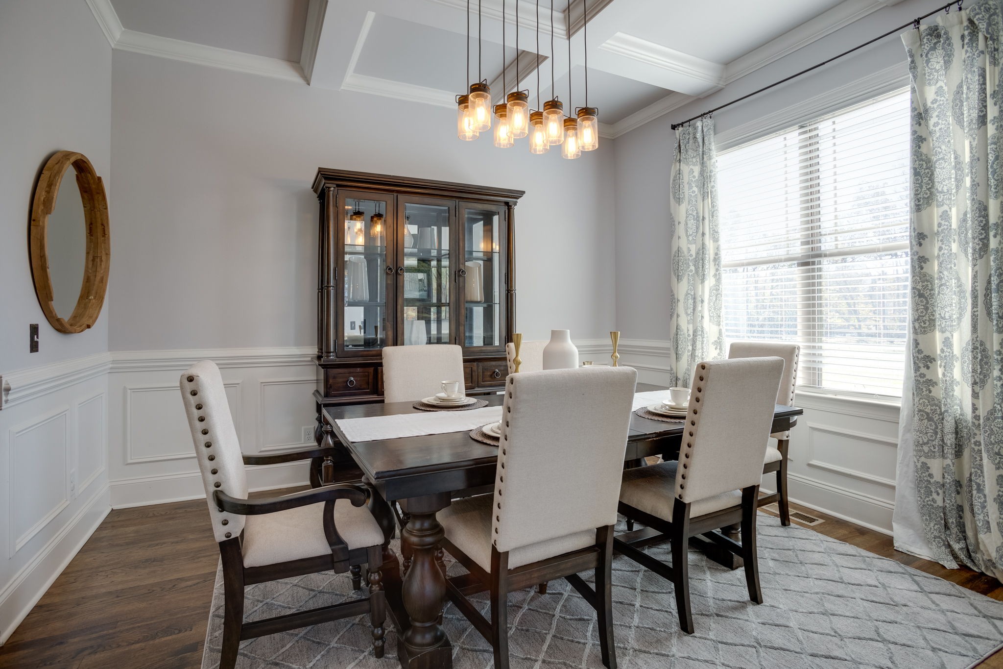 8254 Patterson Road College Grove, TN 37046 - Photo 5 of 30 a dining room with furniture a chandelier and wooden floor