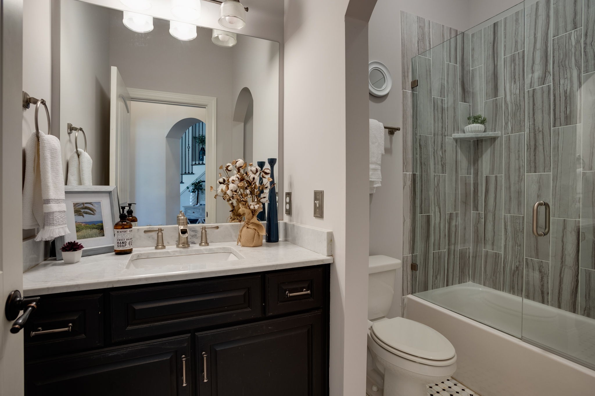 8254 Patterson Road College Grove, TN 37046 - Photo 7 of 30 a bathroom with a sink a toilet a mirror and shower