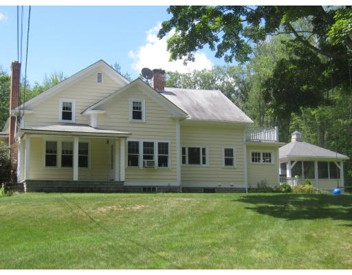 266 Ponakin Road Lancaster, MA 01523 - Photo 1 of 1 a front view of a house with a garden