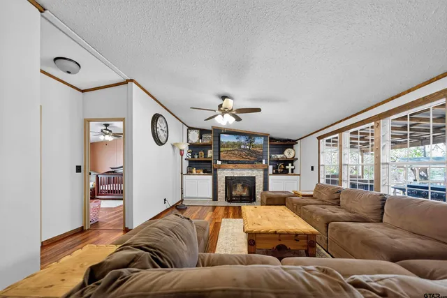 a view of a livingroom with furniture and a fireplace