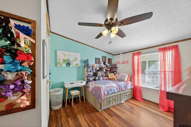 a bedroom with furniture and a window