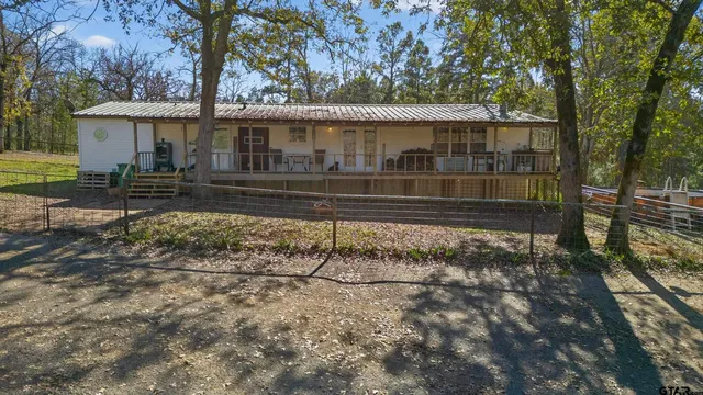 a view of a two chairs in the balcony