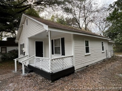 1614 Reeves Street Fayetteville, NC 28306 - Photo 2 of 14 a view of a house with a yard and wooden fence