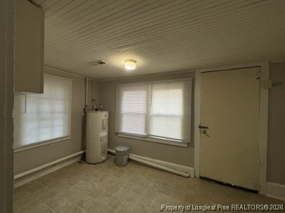 1614 Reeves Street Fayetteville, NC 28306 - Photo 10 of 14 an empty room with windows