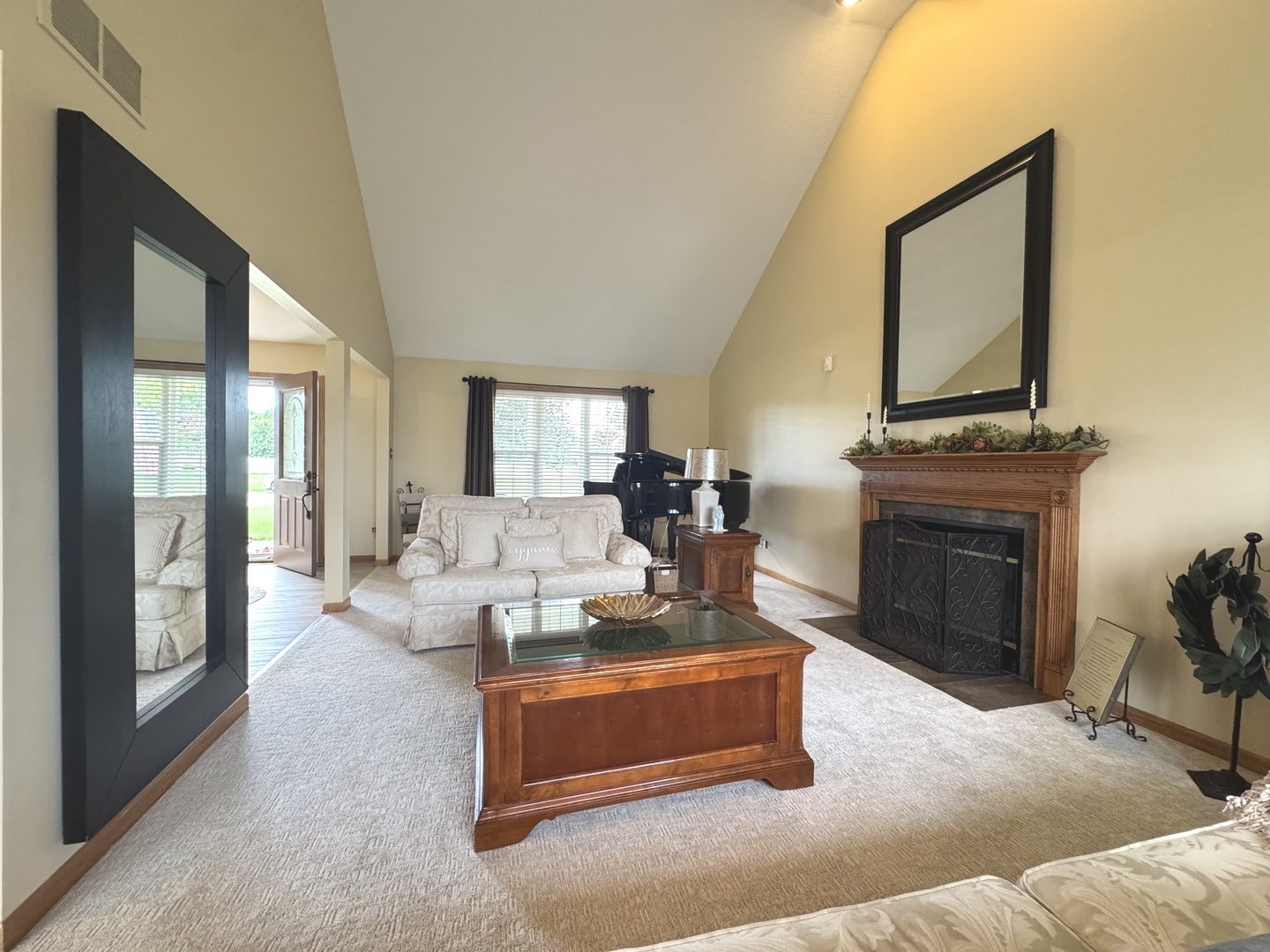 2041 Bluff Road South Kankakee, IL 60901 - Photo 5 of 39 a living room with furniture a fireplace and a large window