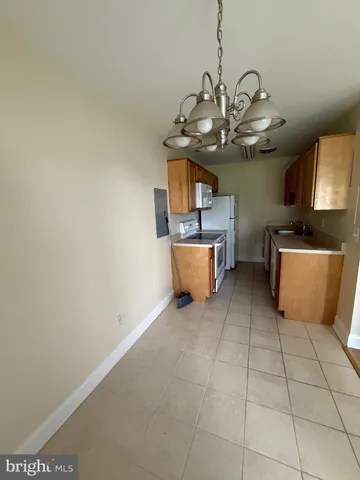 a view of a kitchen with a sink cabinets and a window