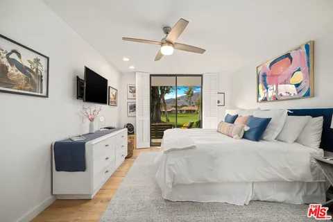 a spacious bathroom with a granite countertop sink toilet and shower