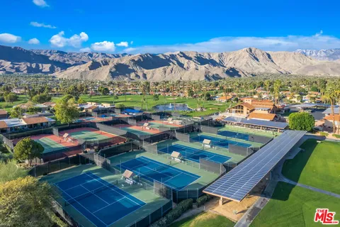 a view of a balcony with outdoor seating