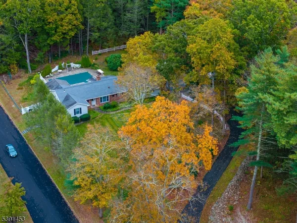 a view of yard with swimming pool and outdoor seating