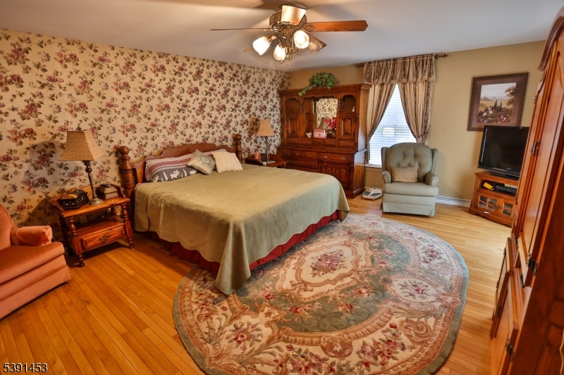 47 New Mashipacong Road Montague, NJ 07827 - Photo 22 of 42 a bedroom with a bed couch and window