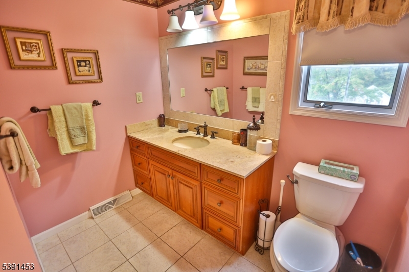 47 New Mashipacong Road Montague, NJ 07827 - Photo 26 of 42 a bathroom with a toilet sink and mirror